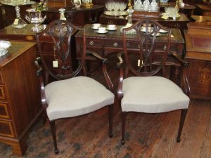 Pair of Antique English Mahogany Hand Carved Shieldback Arm Chairs