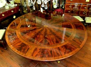 Bench Made Bookmatched Flame Mahogany Inlaid Radially Veneered Regency Style Perimeter Leaf Circular Dining Table